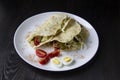 Sliced Ã¢â¬â¹Ã¢â¬â¹chicken with canned  cucumbers and cabbage in sauce, wrapped in pita bread on a white plate. Delicious for lunch or Royalty Free Stock Photo